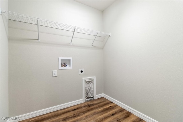 washroom featuring laundry area, baseboards, dark wood finished floors, hookup for a washing machine, and hookup for an electric dryer