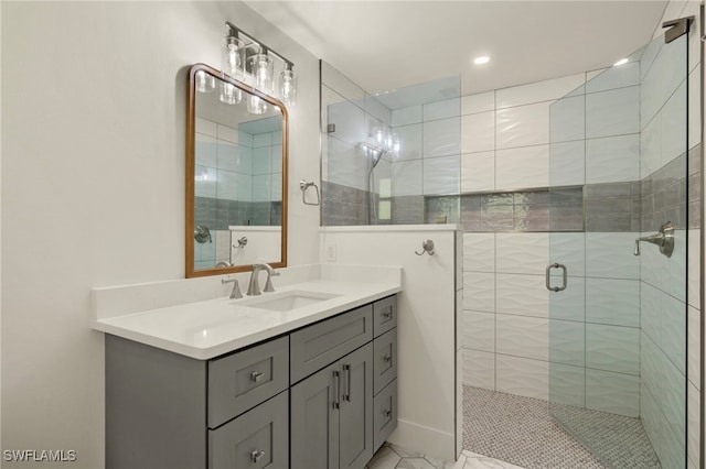 bathroom with a stall shower and vanity