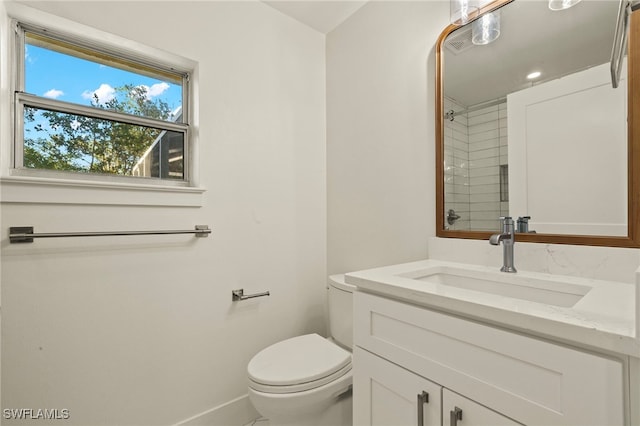 bathroom with toilet and vanity