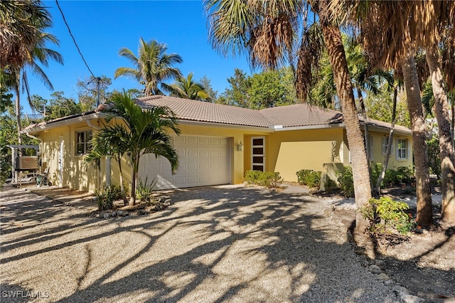 ranch-style home featuring a garage