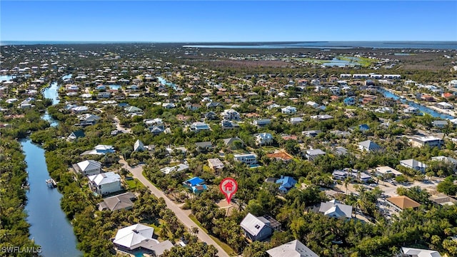 bird's eye view featuring a water view and a residential view