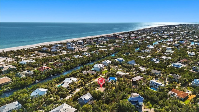 aerial view with a water view and a view of the beach