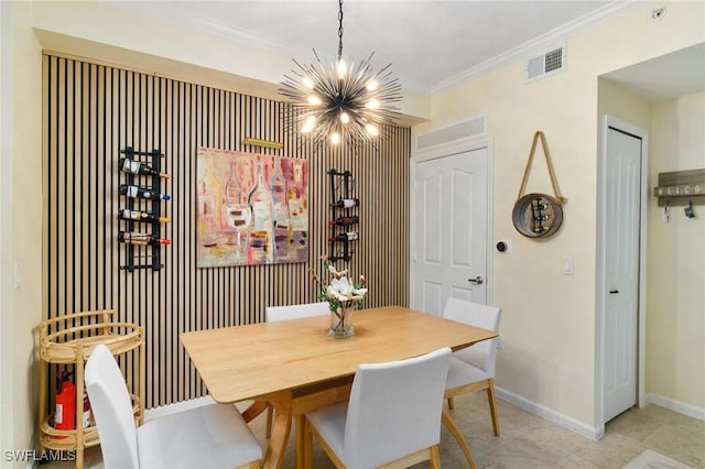 dining room featuring a chandelier, visible vents, crown molding, and baseboards