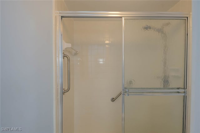 bathroom with a tile shower