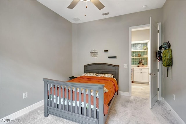 bedroom featuring a ceiling fan, visible vents, light carpet, and baseboards