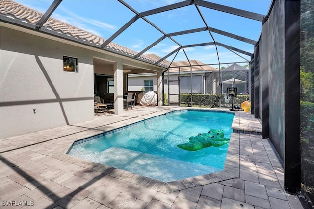 pool featuring a lanai and a patio area