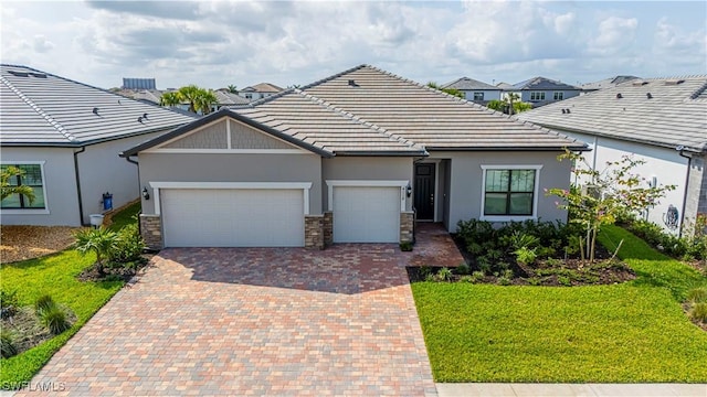 single story home with a garage and a front yard