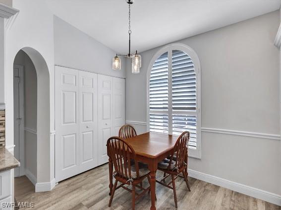 dining room with light hardwood / wood-style flooring