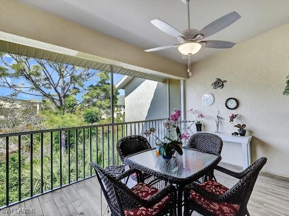 sunroom featuring ceiling fan