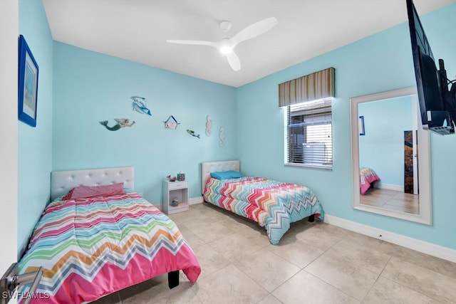 bedroom featuring light tile patterned floors and ceiling fan