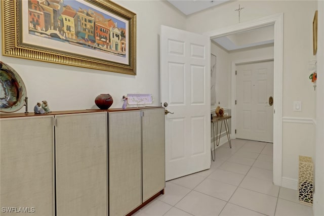 hall with light tile patterned flooring