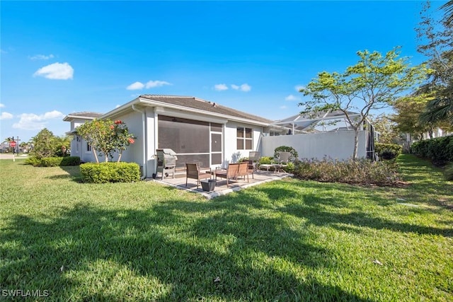 10641 Jackson Square Dr, Estero, FL 33928 - rear view of property with a lawn, stucco siding, fence, and a patio area