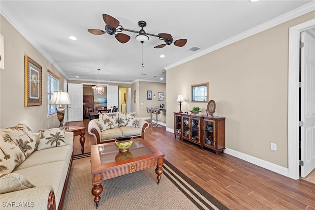 10641 Jackson Square Dr, Estero, FL 33928 - living area with visible vents, baseboards, ceiling fan, ornamental molding, and wood finished floors