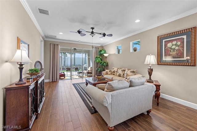 10641 Jackson Square Dr, Estero, FL 33928 - living room with dark wood-type flooring, baseboards, visible vents, ceiling fan, and ornamental molding