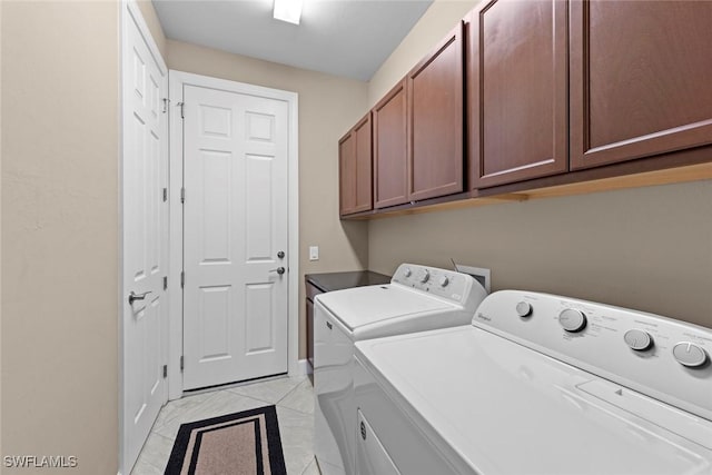 10641 Jackson Square Dr, Estero, FL 33928 - clothes washing area featuring marble finish floor, separate washer and dryer, and cabinet space