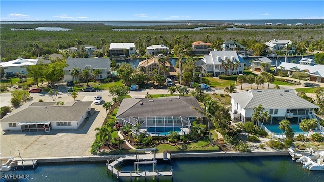 birds eye view of property featuring a residential view and a water view