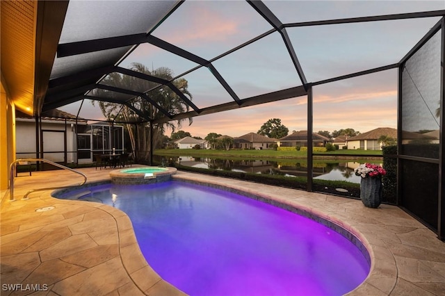 pool at dusk featuring a lanai, an in ground hot tub, a patio, and a water view