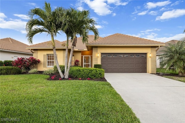 mediterranean / spanish-style house with a garage and a front yard