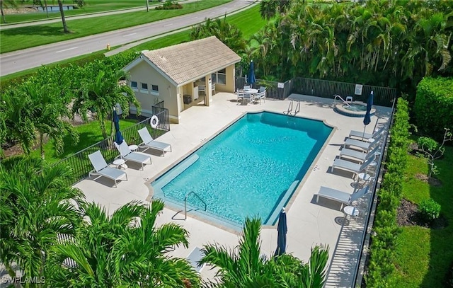 view of swimming pool with a patio