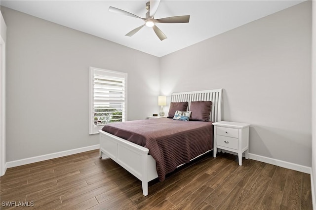 bedroom featuring dark hardwood / wood-style flooring and ceiling fan