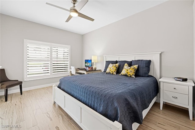 bedroom with ceiling fan and light wood-type flooring