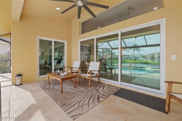 exterior space featuring a lanai and ceiling fan