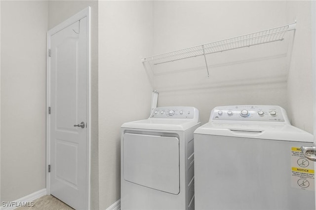 clothes washing area featuring washing machine and clothes dryer