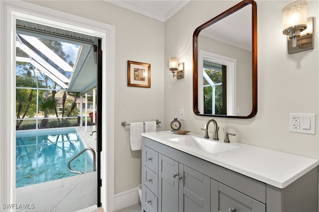 2347 Club House Rd, North Fort Myers, FL 33917 - bathroom featuring baseboards, vanity, and ornamental molding