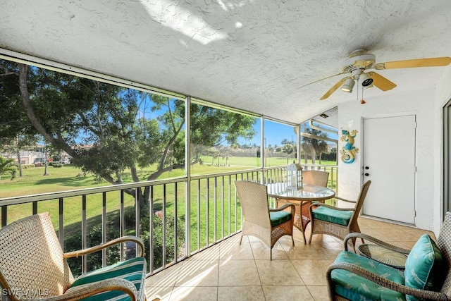 sunroom / solarium with ceiling fan