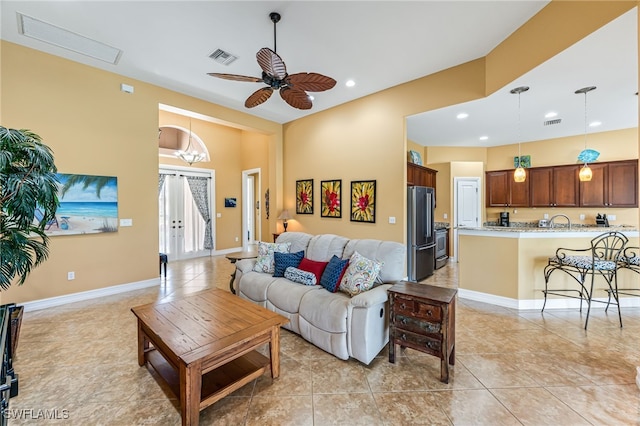 living area featuring recessed lighting, visible vents, baseboards, and light tile patterned flooring