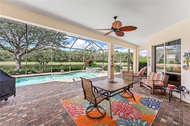 sunroom / solarium featuring ceiling fan and a swimming pool