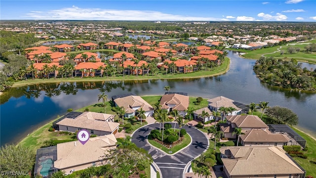 aerial view with a residential view and a water view