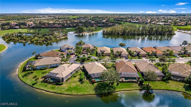 bird's eye view featuring a water view and a residential view