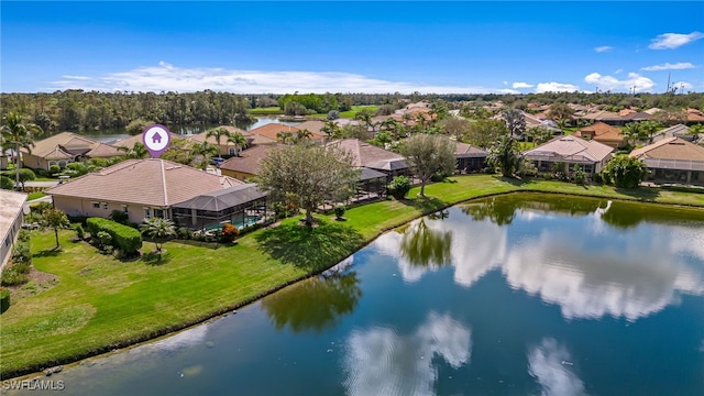 aerial view featuring a water view and a residential view