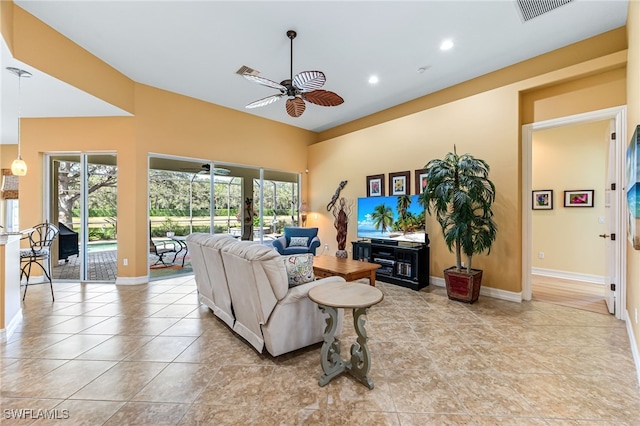 living area featuring light tile patterned floors, visible vents, baseboards, ceiling fan, and recessed lighting