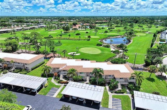 aerial view with a residential view, a water view, and view of golf course