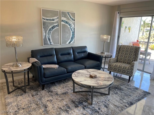 living area featuring baseboards