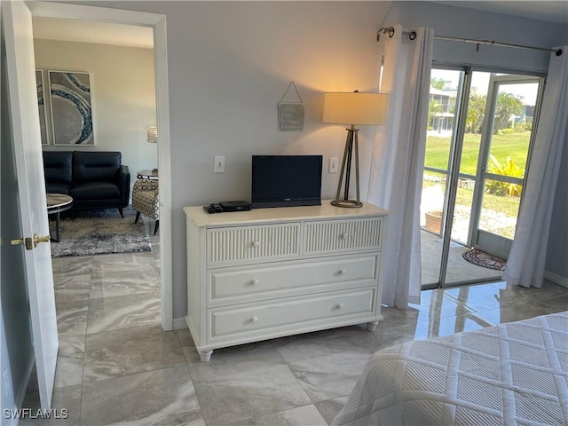 bedroom with access to outside, multiple windows, and marble finish floor