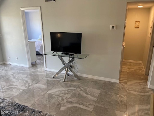 living room with visible vents and baseboards