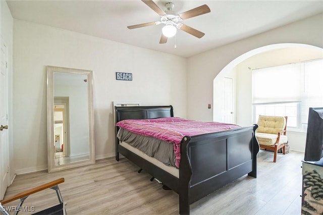 bedroom with ceiling fan and light hardwood / wood-style flooring