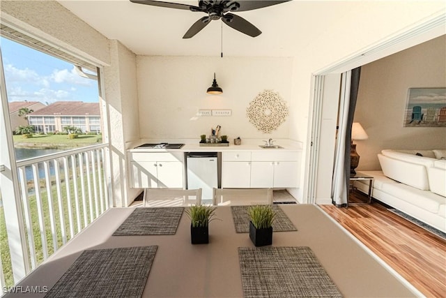 balcony with ceiling fan and a sink