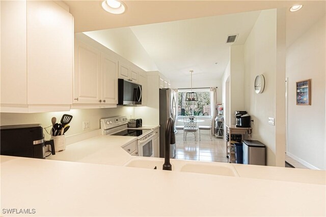 kitchen featuring visible vents, recessed lighting, stainless steel appliances, light tile patterned flooring, and light countertops