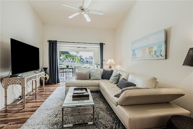 living room featuring a ceiling fan and wood finished floors