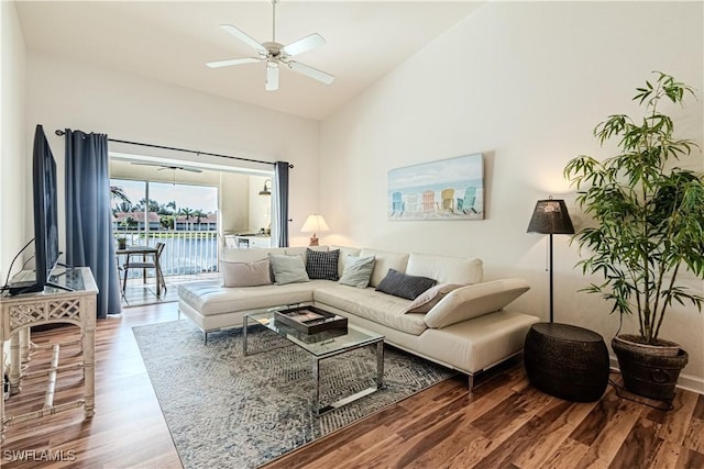 living room featuring high vaulted ceiling, wood finished floors, and a ceiling fan