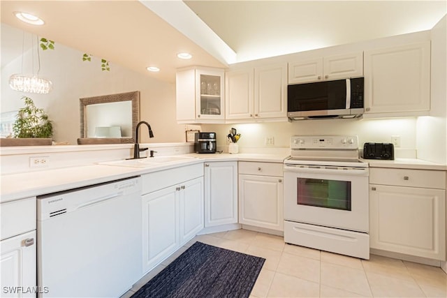 kitchen with a sink, white appliances, white cabinets, light tile patterned floors, and glass insert cabinets