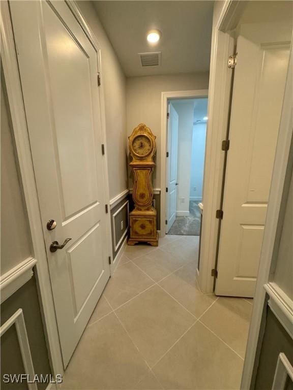 hall with light tile patterned flooring