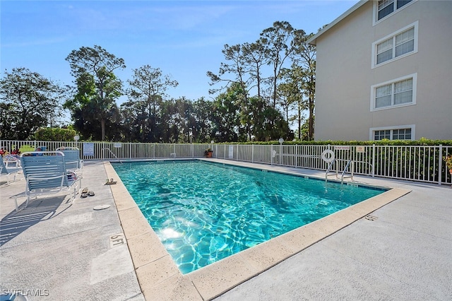 view of pool featuring a patio area