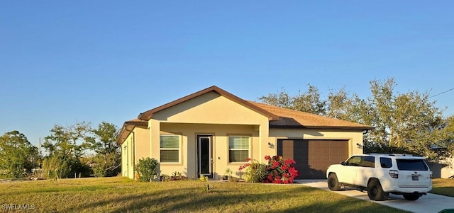 view of front facade with a garage and a front lawn