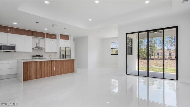 1420 Poinsettia Ave, Lehigh Acres, FL 33972 - kitchen featuring modern cabinets, white cabinets, stainless steel appliances, recessed lighting, and wall chimney exhaust hood