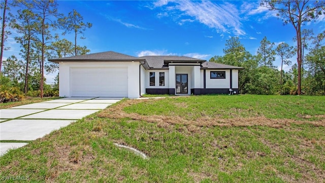 1420 Poinsettia Ave, Lehigh Acres, FL 33972 - view of front of house featuring concrete driveway, an attached garage, a front yard, and stucco siding